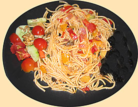 Spaghetti on plate with side dishes