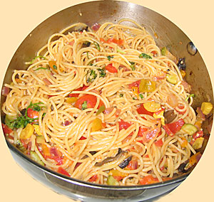 vegetables mixed with spaghetti in pot