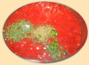 Spices added to pot of canned tomatoes